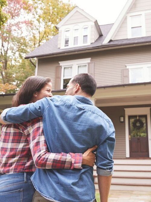 couple walking towards their new home